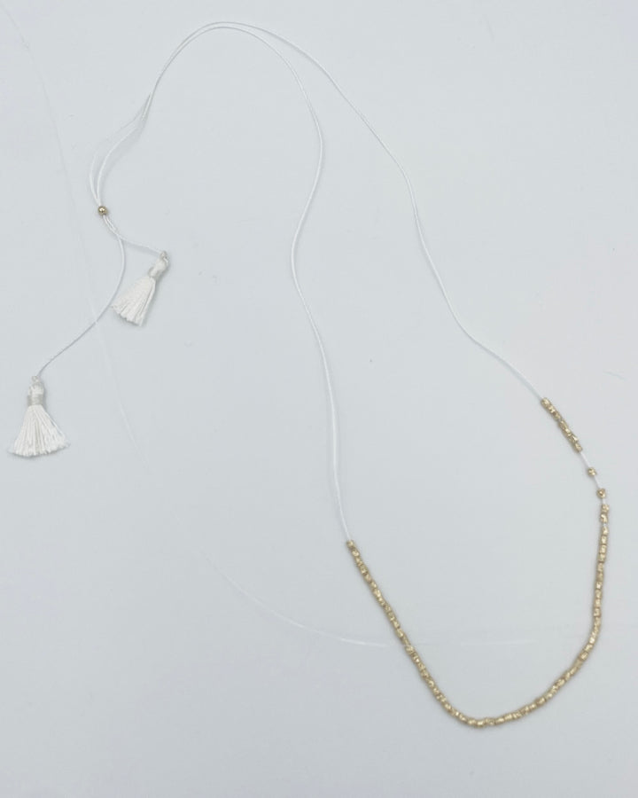 White String Necklace With Gold Beads