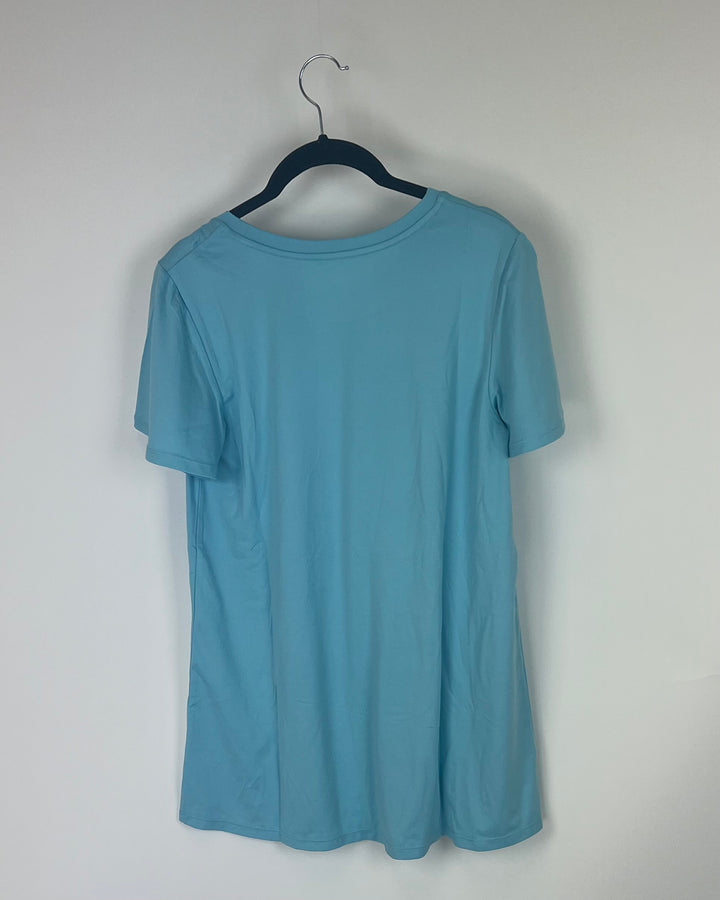 Light Blue Short Sleeve T-Shirt - Size 4/6 and 6/8