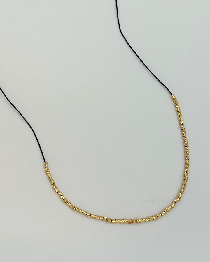 Black String Necklace with Gold Beading